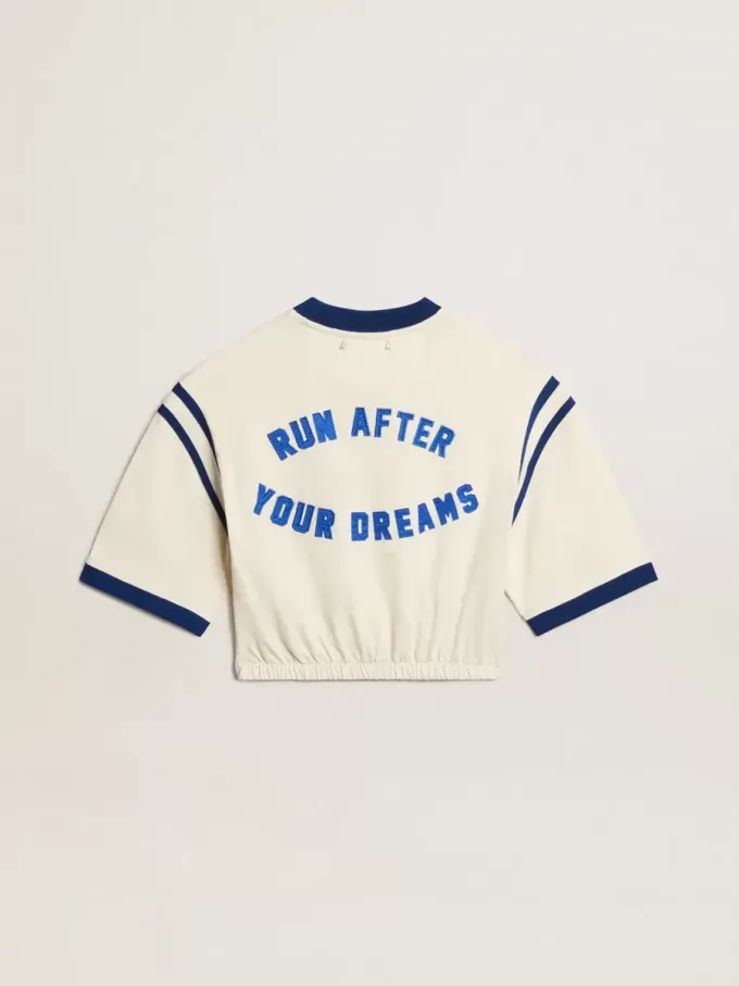 Åldrad vit bomullst-shirt med text på baksidan Åldrad vit bomullst-shirt med text på baksidan