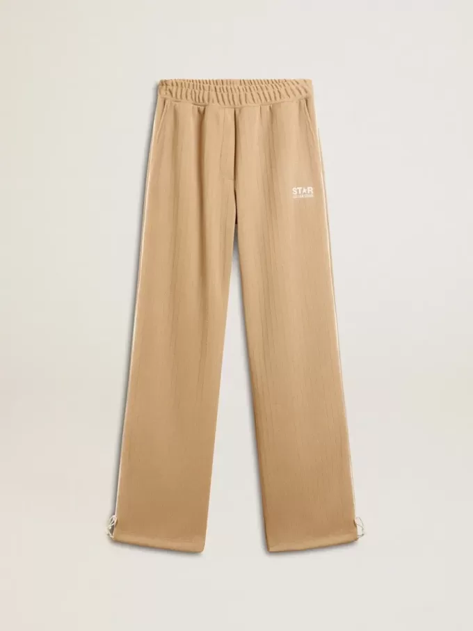 Ljusbeige joggingbyxor för damer med vitt logo Ljusbeige joggingbyxor för damer med vitt logo