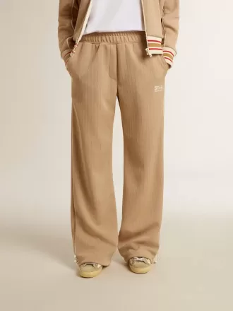 Ljusbeige joggingbyxor för damer med vitt logo