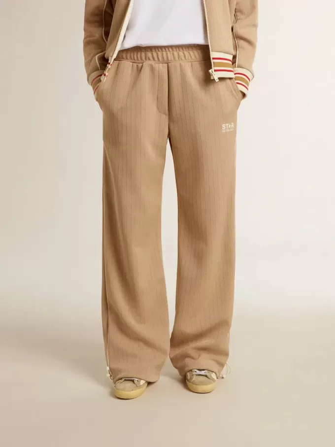 Ljusbeige joggingbyxor för damer med vitt logo Ljusbeige joggingbyxor för damer med vitt logo
