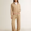 Ljusbeige joggingbyxor för damer med vitt logo Ljusbeige joggingbyxor för damer med vitt logo