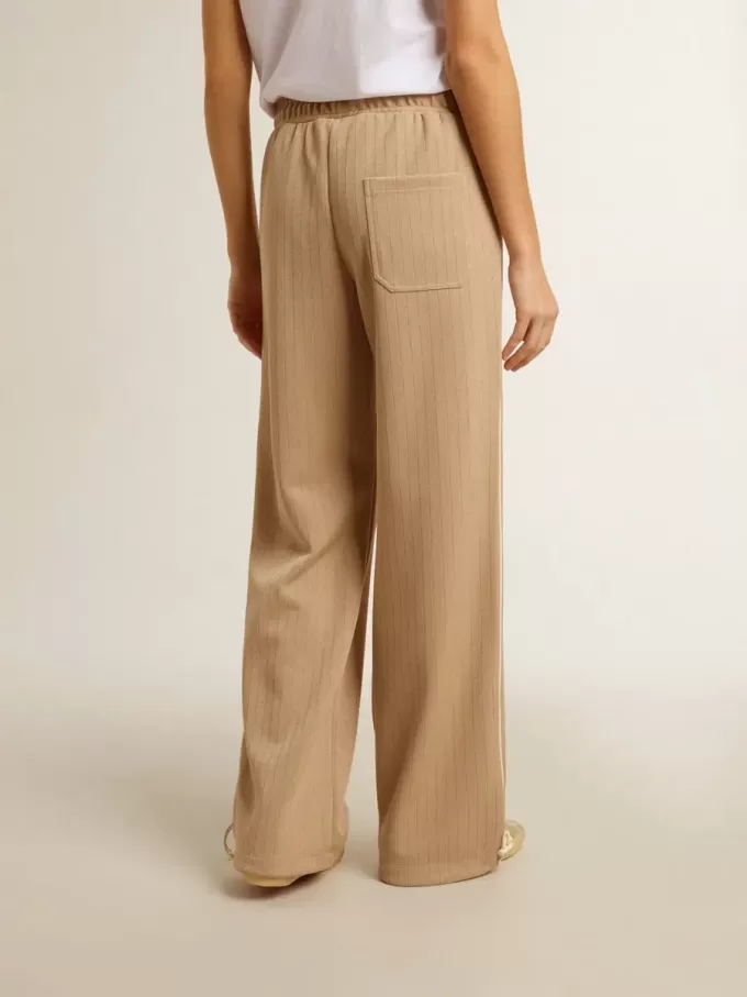 Ljusbeige joggingbyxor för damer med vitt logo Ljusbeige joggingbyxor för damer med vitt logo