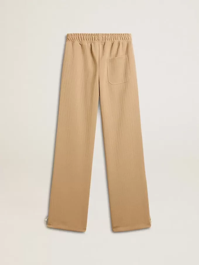 Ljusbeige joggingbyxor för damer med vitt logo Ljusbeige joggingbyxor för damer med vitt logo