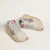 Marathon för damer med beige nylonöverdel och grå stjärna