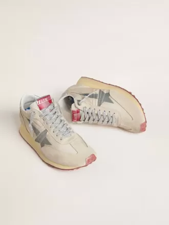 Marathon för damer med beige nylonöverdel och grå stjärna