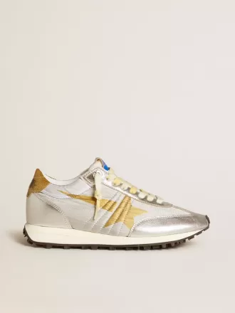 Marathon för damer med silverfärgat ripstop-nylonöverdel och guldstjärna