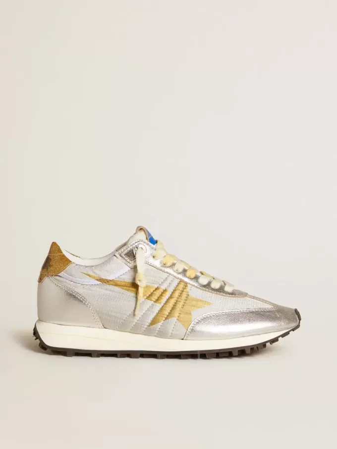 Marathon för damer med silverfärgat ripstop-nylonöverdel och guldstjärna
