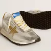 Marathon för damer med silverfärgat ripstop-nylonöverdel och guldstjärna