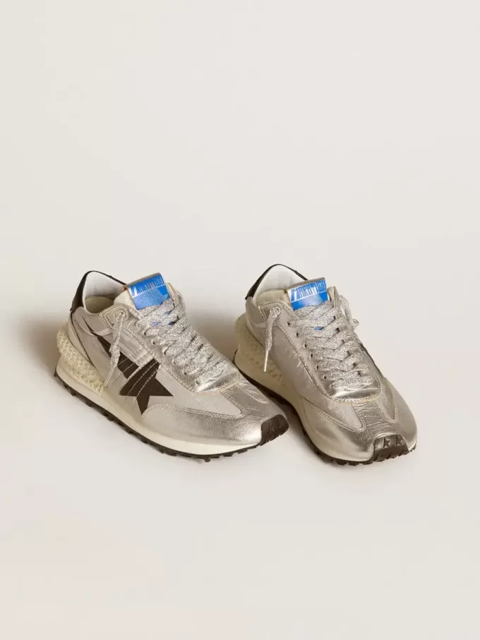 Marathon för damer med silverfärgat ripstop-nylonöverdel och svart stjärna