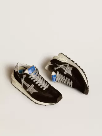 Marathon för damer med svart ovandel i ripstop-nylon och silverstjärna