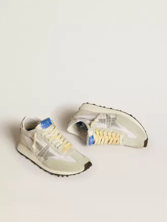 Marathon för damer med vit nylonöverdel och silverstjärna