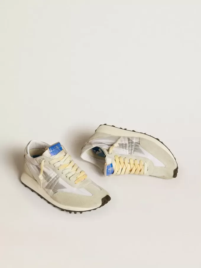 Marathon för damer med vit nylonöverdel och silverstjärna