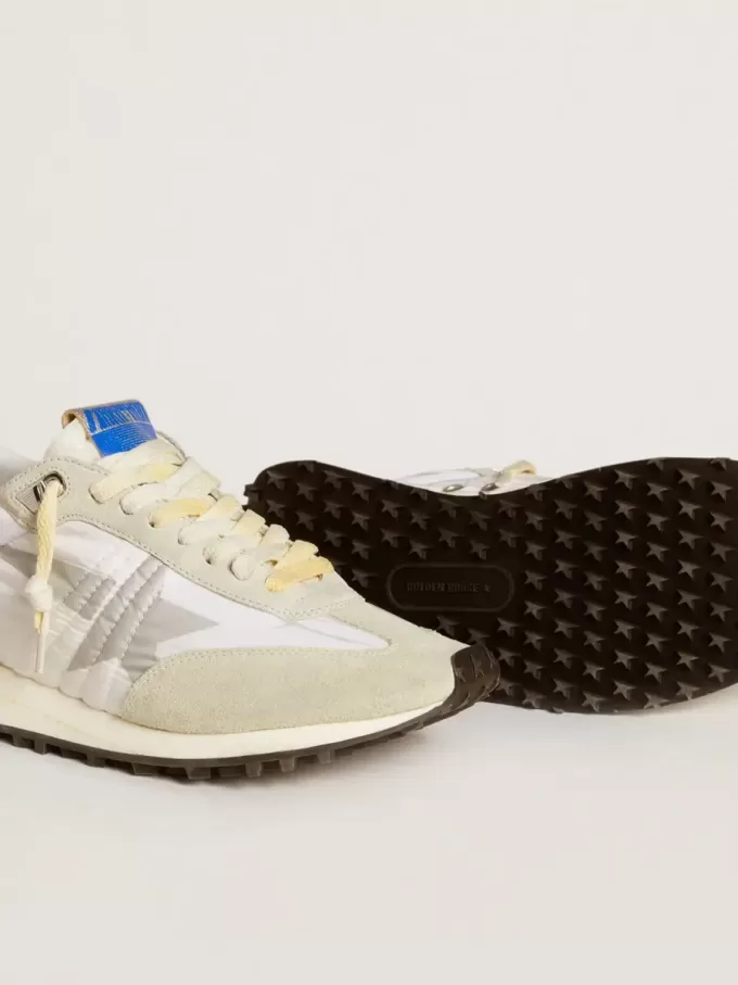 Marathon för damer med vit nylonöverdel och silverstjärna