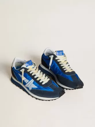 Marathon för herr med blå nylonöverdel och vit stjärna