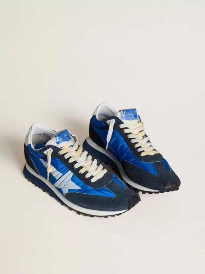 Marathon för herr med blå nylonöverdel och vit stjärna Marathon för herr med blå nylonöverdel och vit stjärna