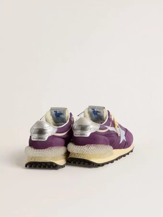 Marathon för herr med lila nylonöverdel och vit stjärna Marathon för herr med lila nylonöverdel och vit stjärna