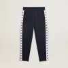 Mörkblå joggingbyxor med vit rand och kontrasterande stjärnor Mörkblå joggingbyxor med vit rand och kontrasterande stjärnor