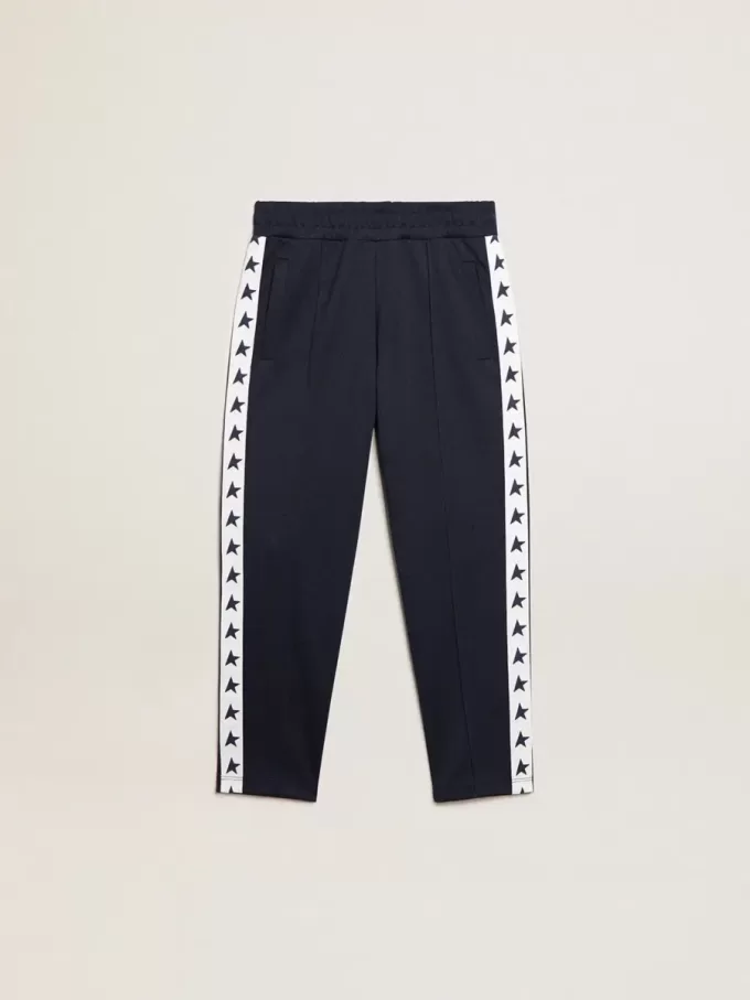 Mörkblå joggingbyxor med vit rand och kontrasterande stjärnor Mörkblå joggingbyxor med vit rand och kontrasterande stjärnor