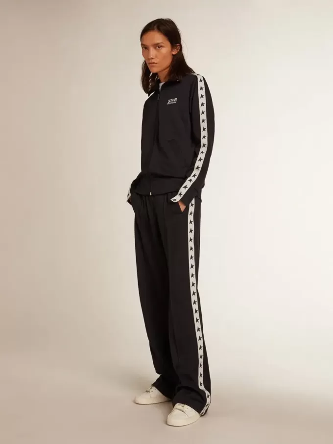 Mörkblå sweatshirt med dragkedja, vit rand och kontrasterande stjärnor
