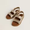 Noa Junior-sandaler i mikroglitter och platinaläder Noa Junior-sandaler i mikroglitter och platinaläder