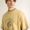 Oversized gul bomullst-shirt för herr med blå tryck