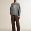 Oversized sweatshirt i babyblått med slitna detaljer