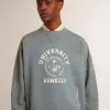 Oversized sweatshirt i babyblått med slitna detaljer