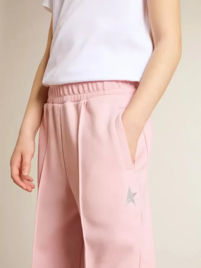 Rosa joggingbyxor med glitterstjärna på framsidan