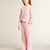 Rosa sweatshirt med maxistjärna i silverglitter på framsidan