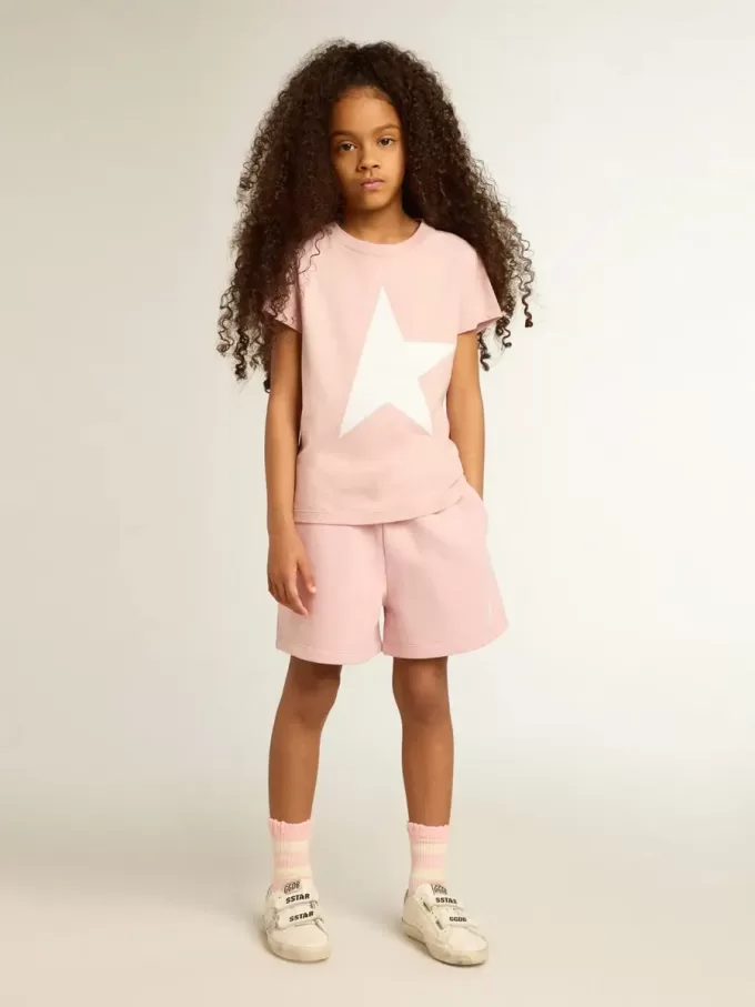 Rosa T-shirt för flickor med vit logotyp och stor stjärna