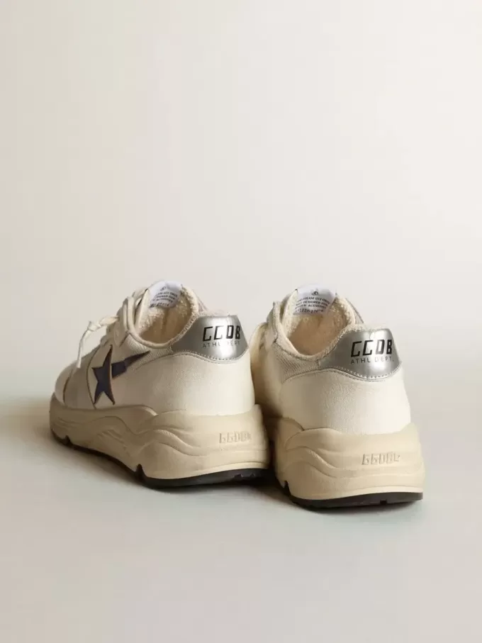 Running Sole i vitt läder och mesh med blå laminatläderstjärna
