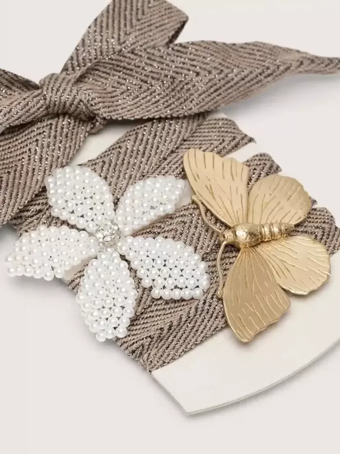 Skin ”Sparkling” bruna, svarta och silverfärgade snören med fiskbensmönster och två applikationer
