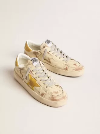Stardan för herr i beige läder med honungsfärgad nubuckstjärna och hälflik
