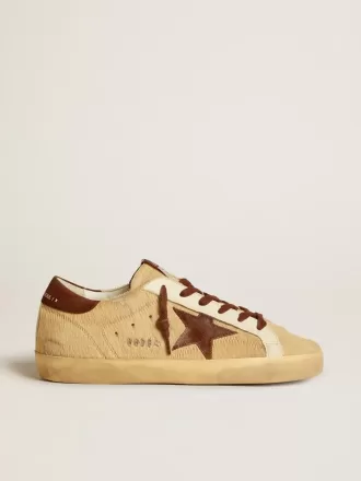 Super-Star för dam i beige ponnyhud med brun mockastjärna och hälflik