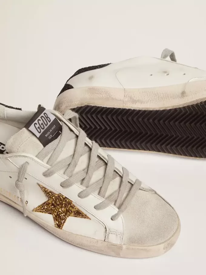 Super-Star för damer i nappaläder med guldglittrande stjärna och svart glittrande hälflik Super-Star för damer i nappaläder med guldglittrande stjärna och svart glittrande hälflik