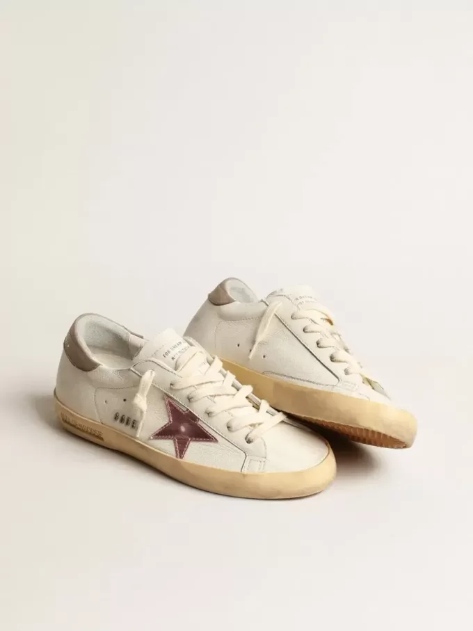 Super-Star för damer i vitt nappa med rosa metallisk läderstjärna Super-Star för damer i vitt nappa med rosa metallisk läderstjärna