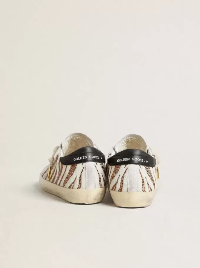 Super-Star LTD för damer i vitt ponnyläder med brunt glitter och vit mockastjärna Super-Star LTD för damer i vitt ponnyläder med brunt glitter och vit mockastjärna