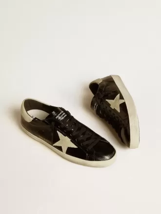Super-Star LTD för herr i svart lackläder med stjärna och hälflik i mocka Super-Star LTD för herr i svart lackläder med stjärna och hälflik i mocka