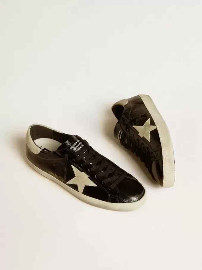 Super-Star LTD för herr i svart lackläder med stjärna och hälflik i mocka Super-Star LTD för herr i svart lackläder med stjärna och hälflik i mocka