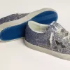Super-Star LTD i flerfärgat glitter med silvermetallisk läderstjärna Super-Star LTD i flerfärgat glitter med silvermetallisk läderstjärna