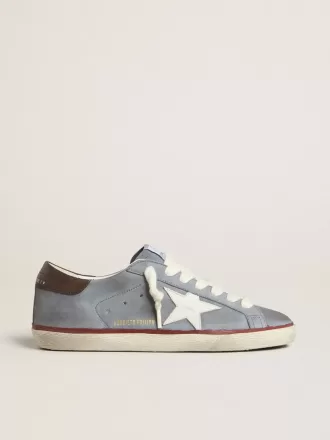 Super-Star LTD i ljusblått nubuckläder med vit läderstjärna och brun läderhälflik Super-Star LTD i ljusblått nubuckläder med vit läderstjärna och brun läderhälflik