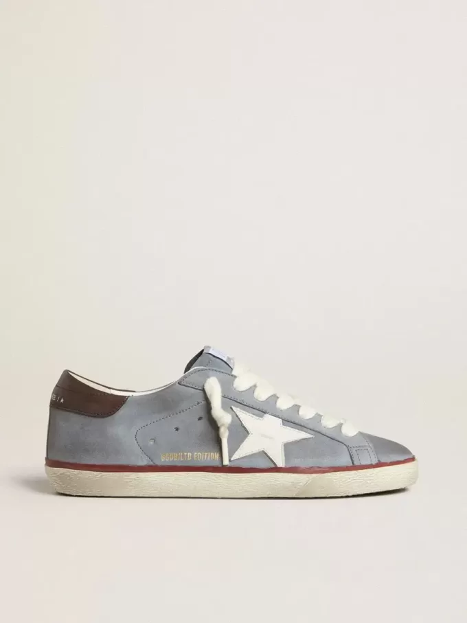 Super-Star LTD i ljusblått nubuckläder med vit läderstjärna och brun läderhälflik Super-Star LTD i ljusblått nubuckläder med vit läderstjärna och brun läderhälflik