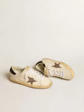 Super-Star LTD med laminerad läderstjärna och svart glitterhälflik
