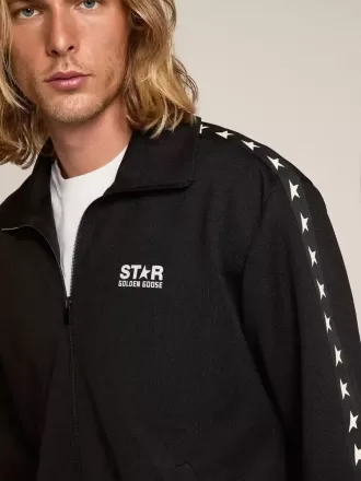 Svart sweatshirt med dragkedja och vita stjärnor för herr