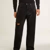 Svarta jeans för herr med lös passform och kristaller med gradienteffekt över hela plagget Svarta jeans för herr med lös passform och kristaller med gradienteffekt över hela plagget