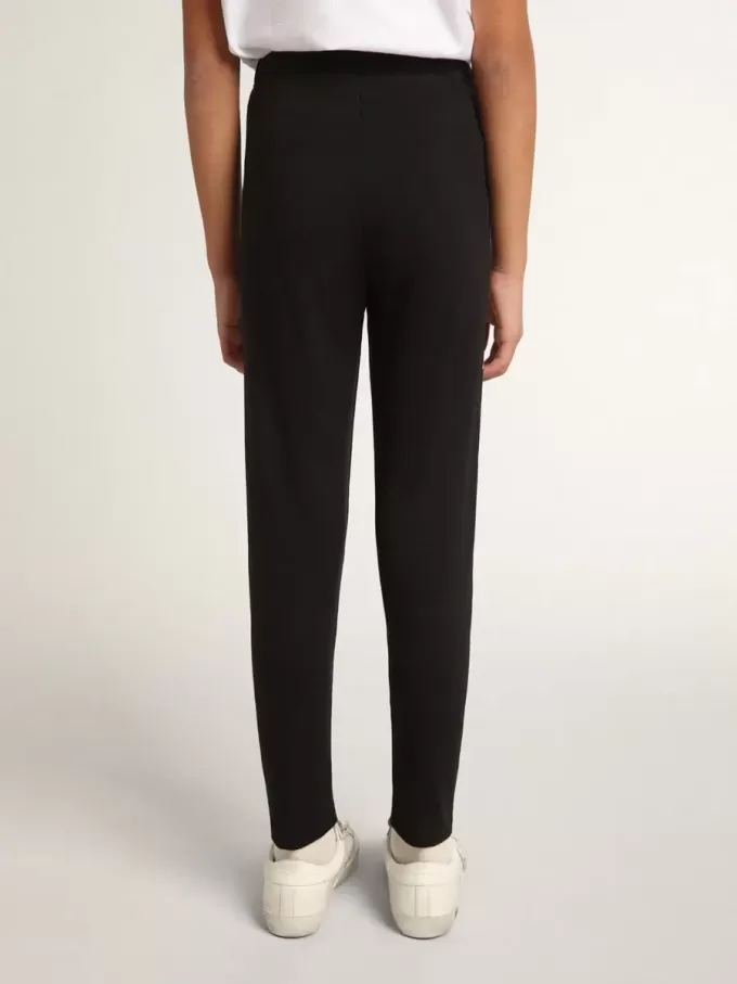 Svarta leggings för flickor med vita stjärnor på sidorna Svarta leggings för flickor med vita stjärnor på sidorna