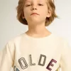 Sweatshirt i åldrat vitt med flerfärgad Golden-text på framsidan Sweatshirt i åldrat vitt med flerfärgad Golden-text på framsidan