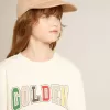 Sweatshirt i åldrat vitt med flerfärgad Golden-text på framsidan Sweatshirt i åldrat vitt med flerfärgad Golden-text på framsidan