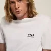 T-shirt från White Star Collection med kontrasterande svart logotyp och stjärna T-shirt från White Star Collection med kontrasterande svart logotyp och stjärna