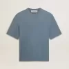 Unisex-T-shirt i bomull i babyblått med omvänd tryck på baksidan Unisex-T-shirt i bomull i babyblått med omvänd tryck på baksidan
